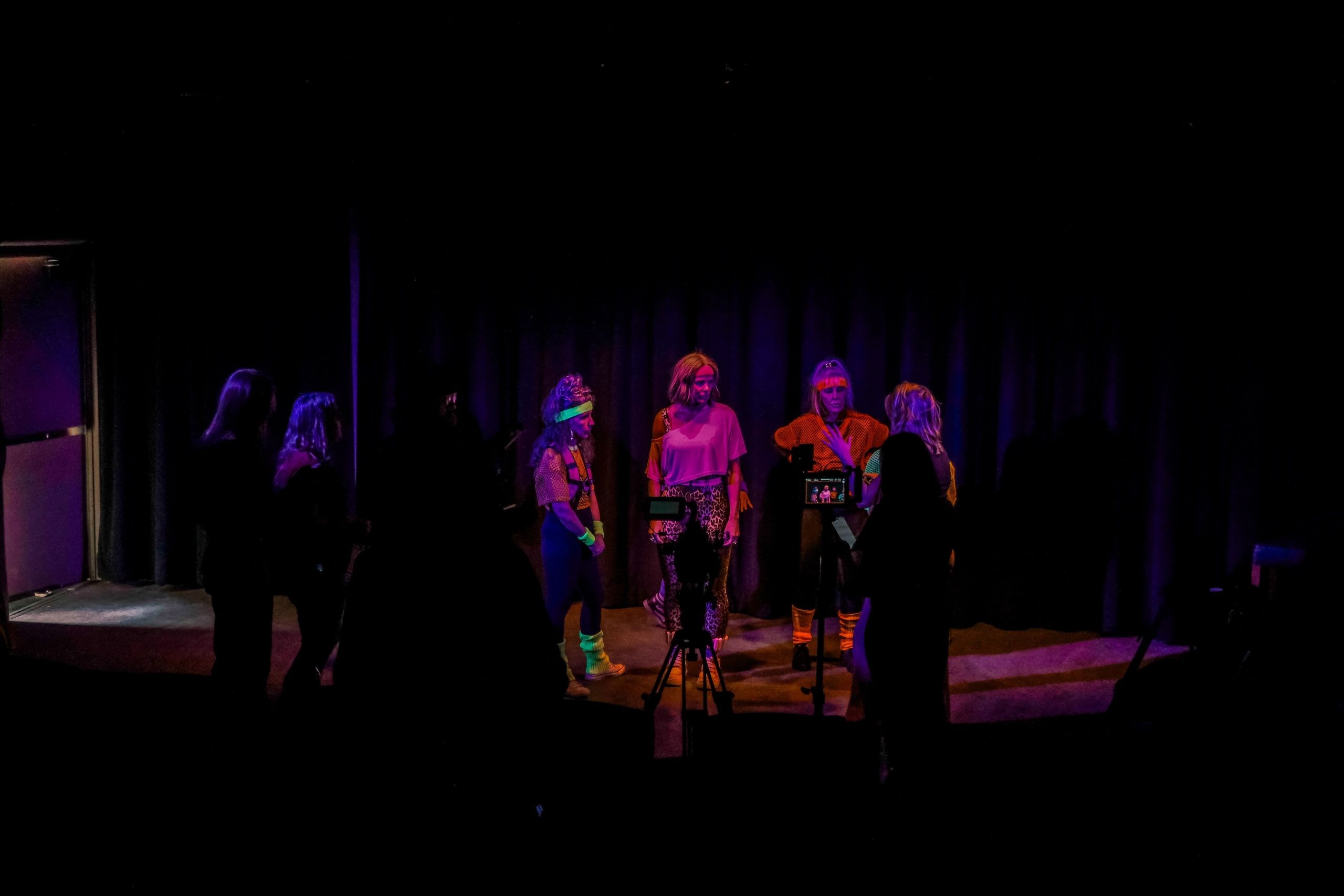 Stage performance with neon lighting